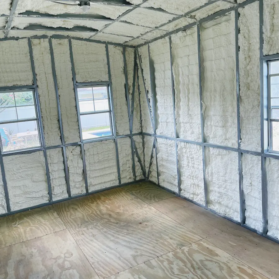 Closed-cell spray foam insulation applied to wall cavities in a residential project in Janesville